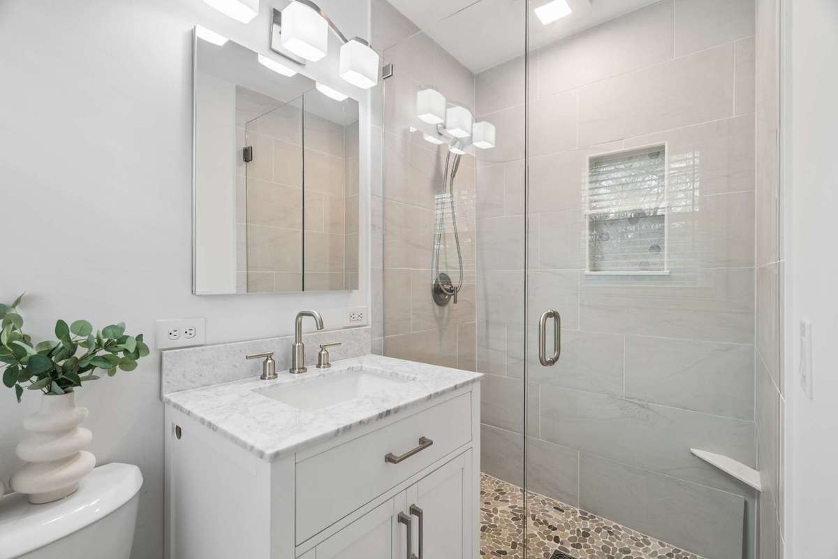 Renovated primary bath with tile shower