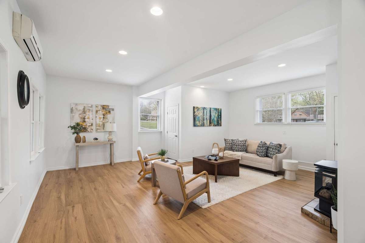 This large flex space could be a 4th bedroom, office, game room or play room. It's adjacent to the kitchen, and includes a half bath.