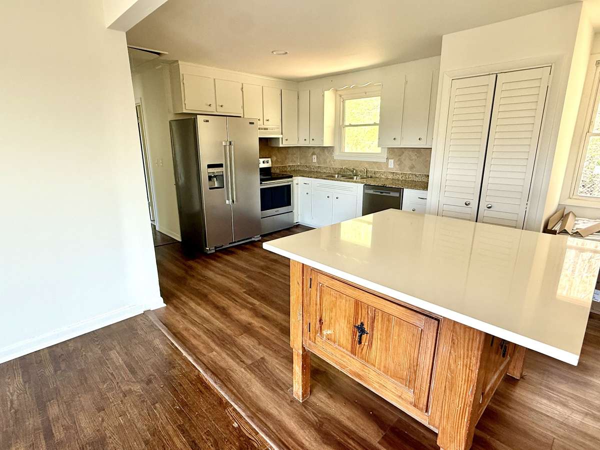 Kitchen adjoins living room