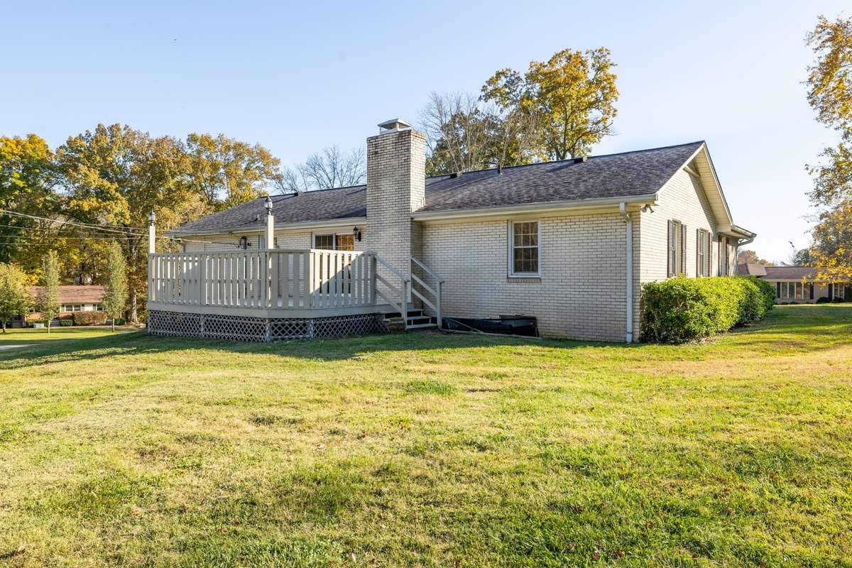 Bakc view of home with new deck and double lots
