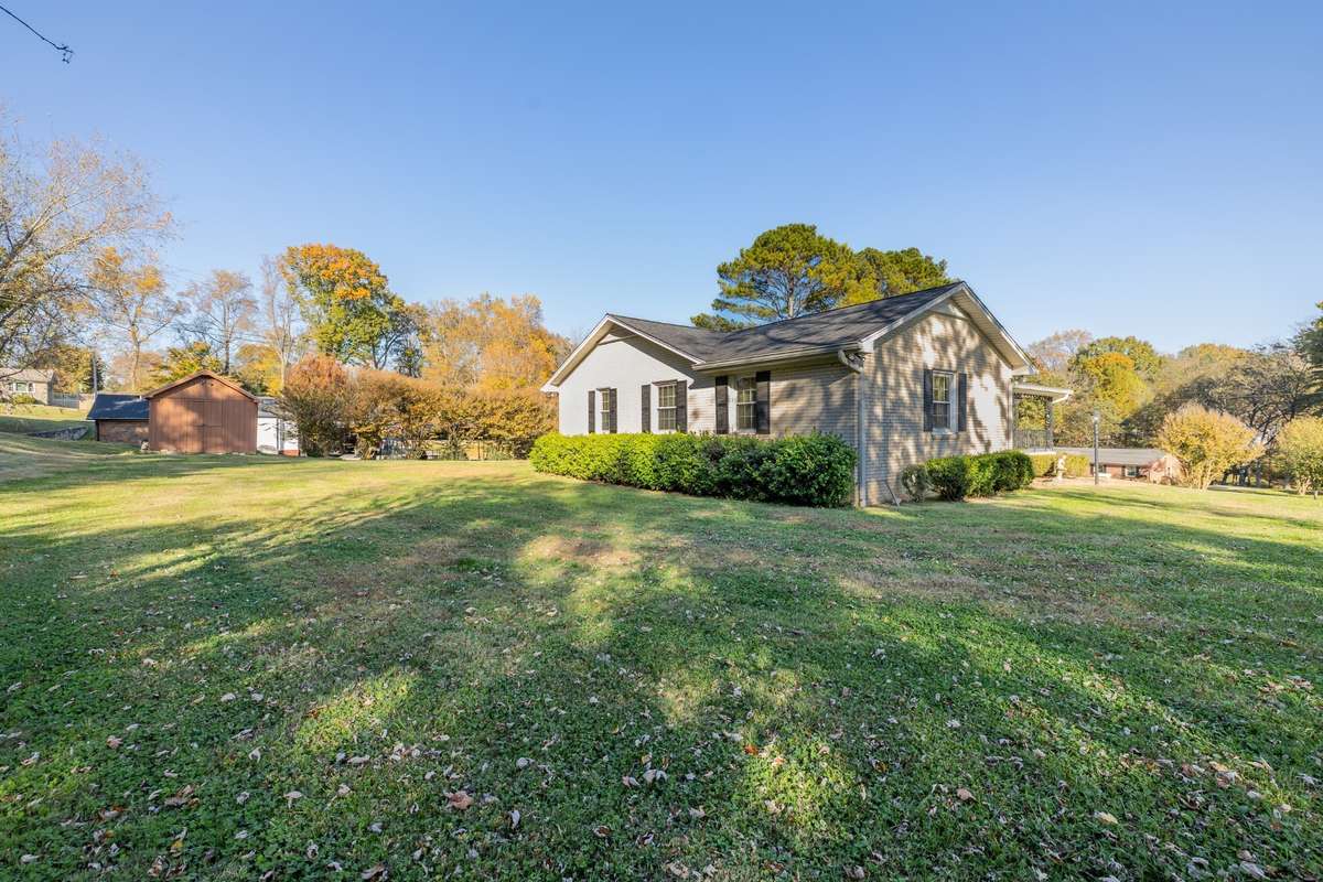 Back of home with large lot