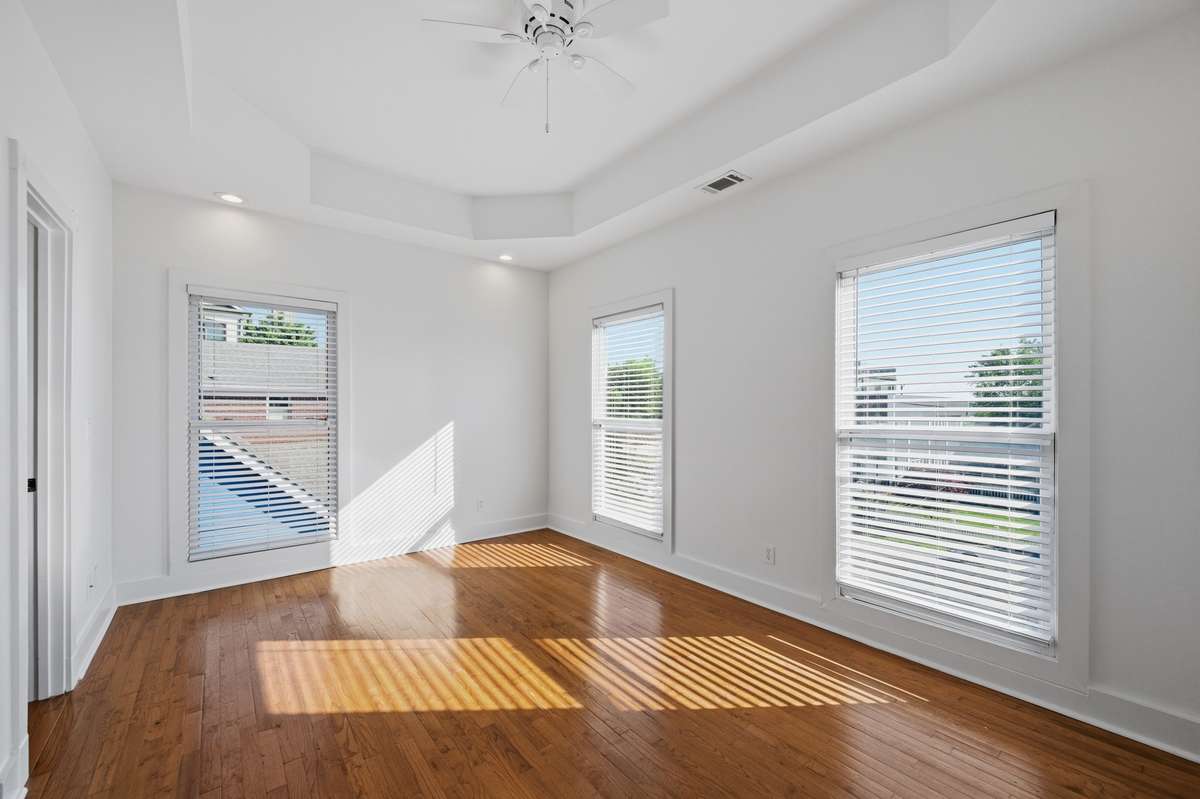 The primary bedroom on the second floor. Big windows, great natural light, and plenty of room for your king bed and furniture. Also notice the 9 foot ceilings on the second floor as well.
