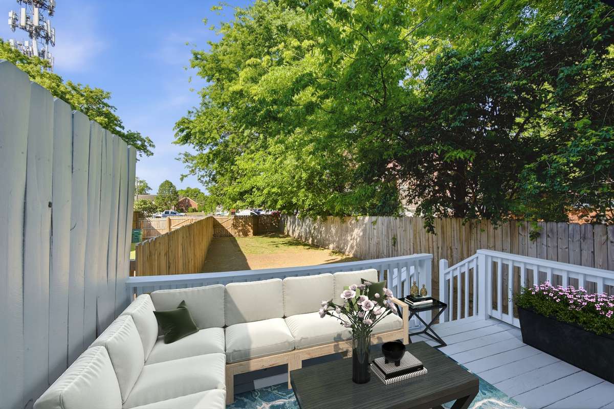 This is a rarity so close to downtown Nashville: a private deck and deep back yard with grass, a parking pad, and gate to pull your cars through. Virtually staged.