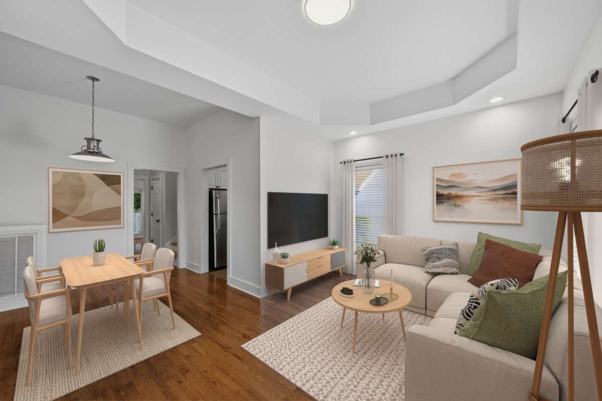 Just inside the front door, you are greeted with tall ceilings, tons of natural light, and real hardwood floors. Virtually staged.