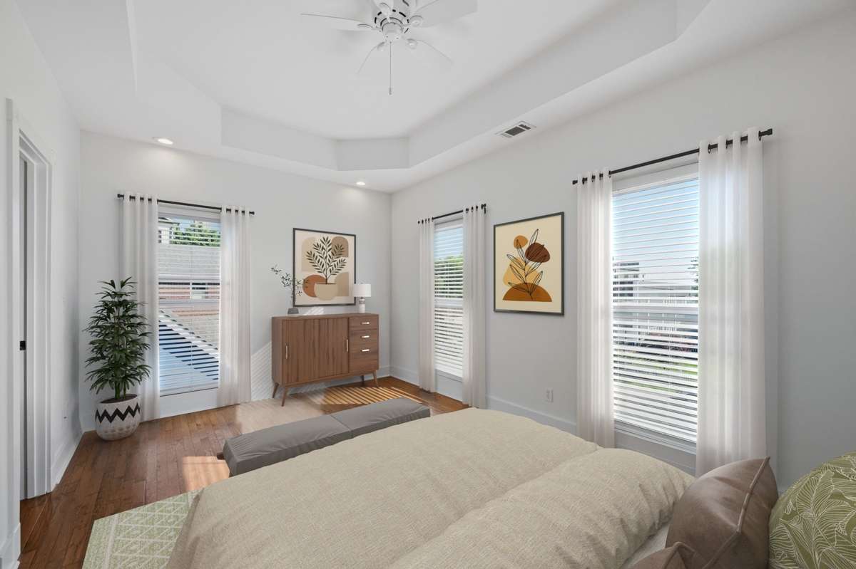 The primary bedroom on the second floor. Big windows, great natural light, and plenty of room for your king bed and furniture. Also notice the 9 foot ceilings on the second floor as well. Virtually staged.