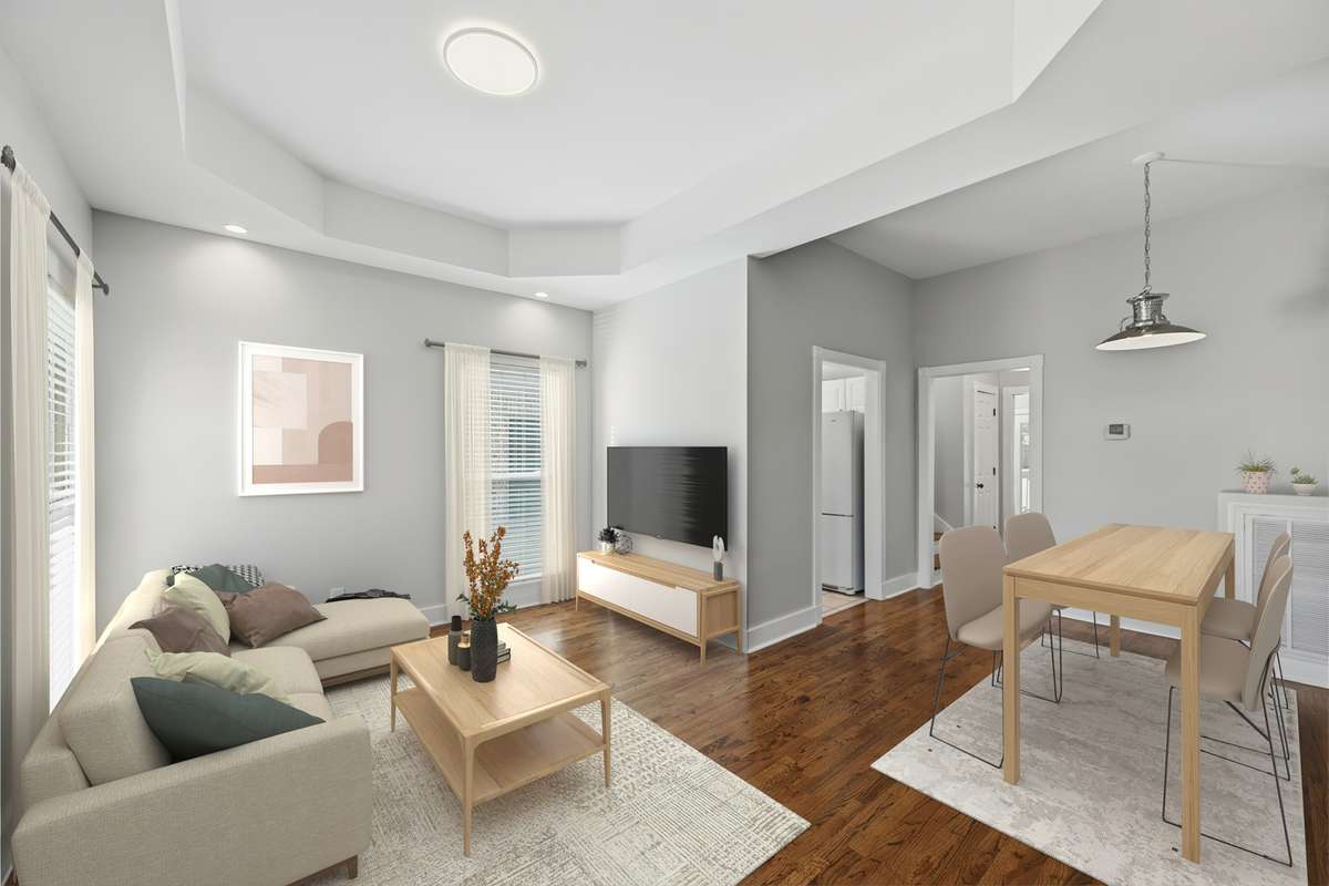 Just inside the front door, you are greeted with tall ceilings, tons of natural light, and real hardwood floors. Virtually staged.