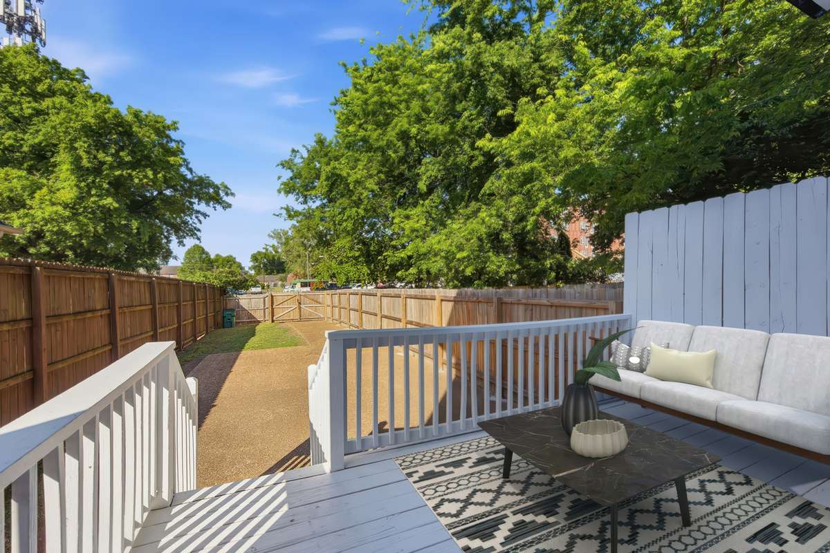 This is a rarity so close to downtown Nashville: a private deck and deep back yard with grass, a parking pad, and gate to pull your cars through. Virtually staged.