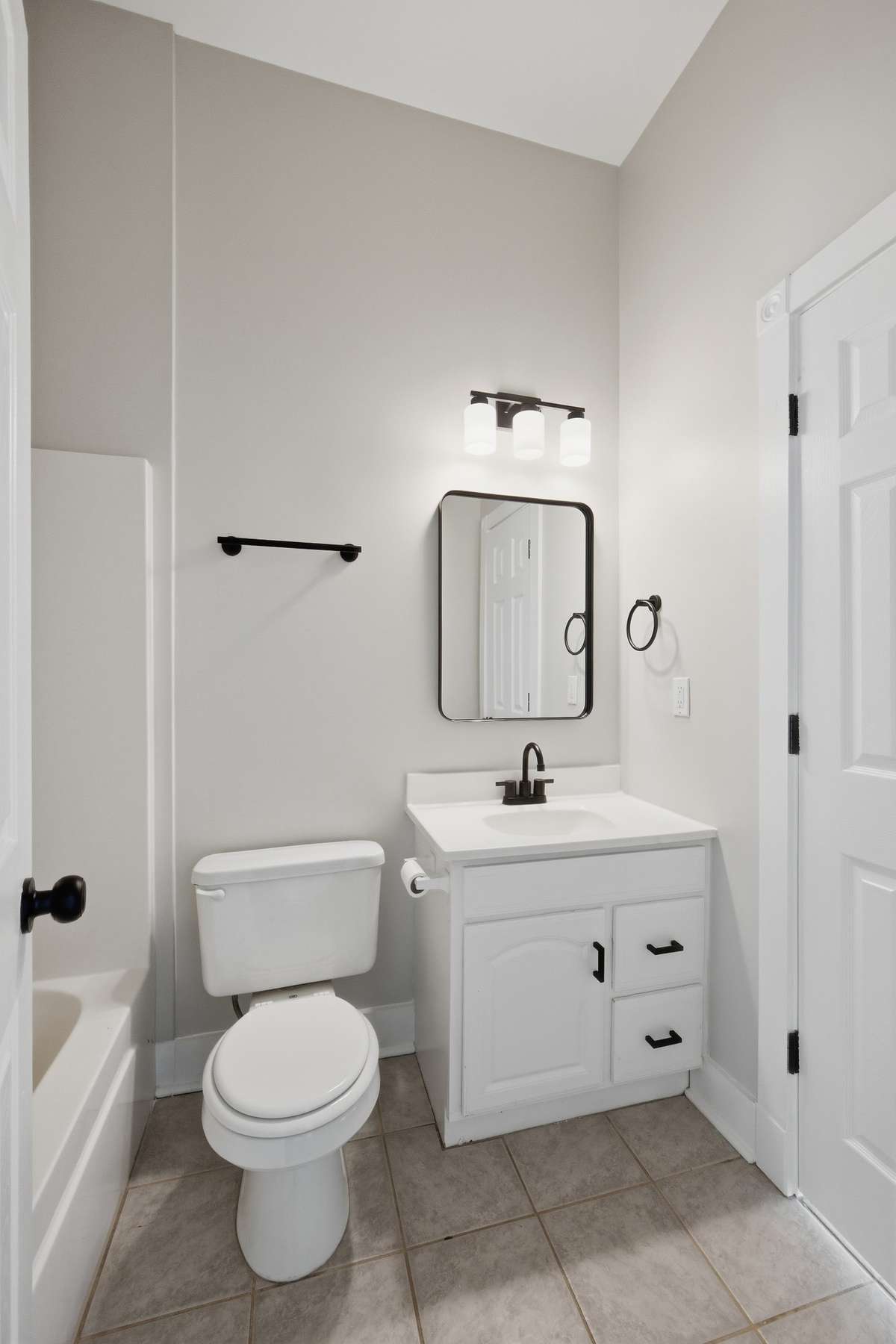The full bath on the second floor (tub/shower combo out of frame to left), which has access from both the primary bedroom and the hallway.