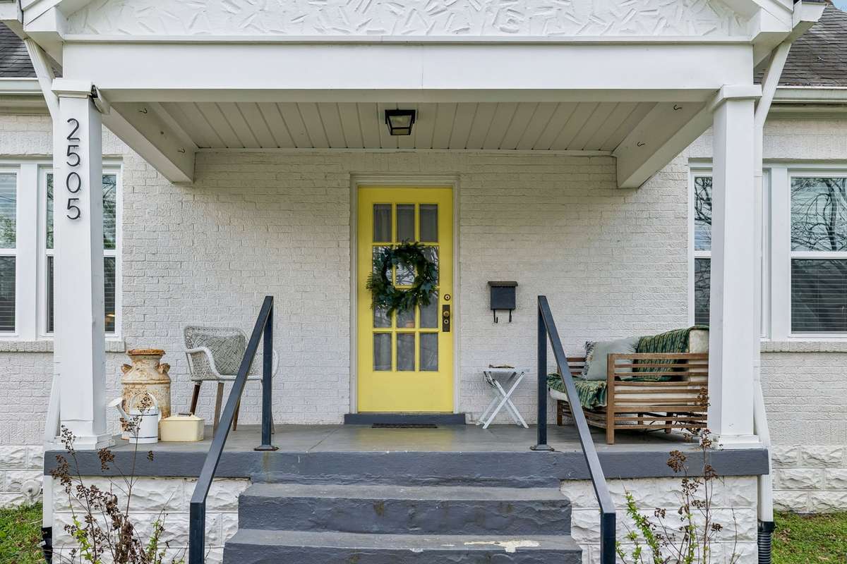 Lovely front porch in this sidewalk community