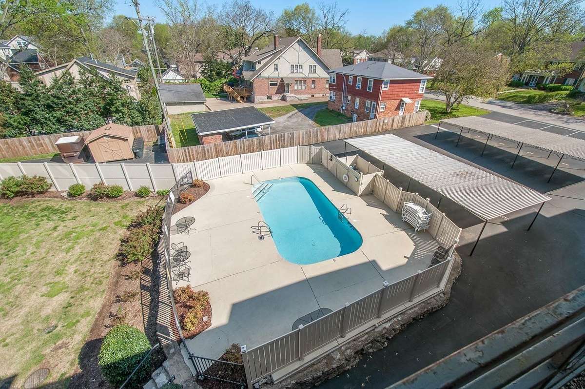 Overlooking the community pool from the covered balcony
