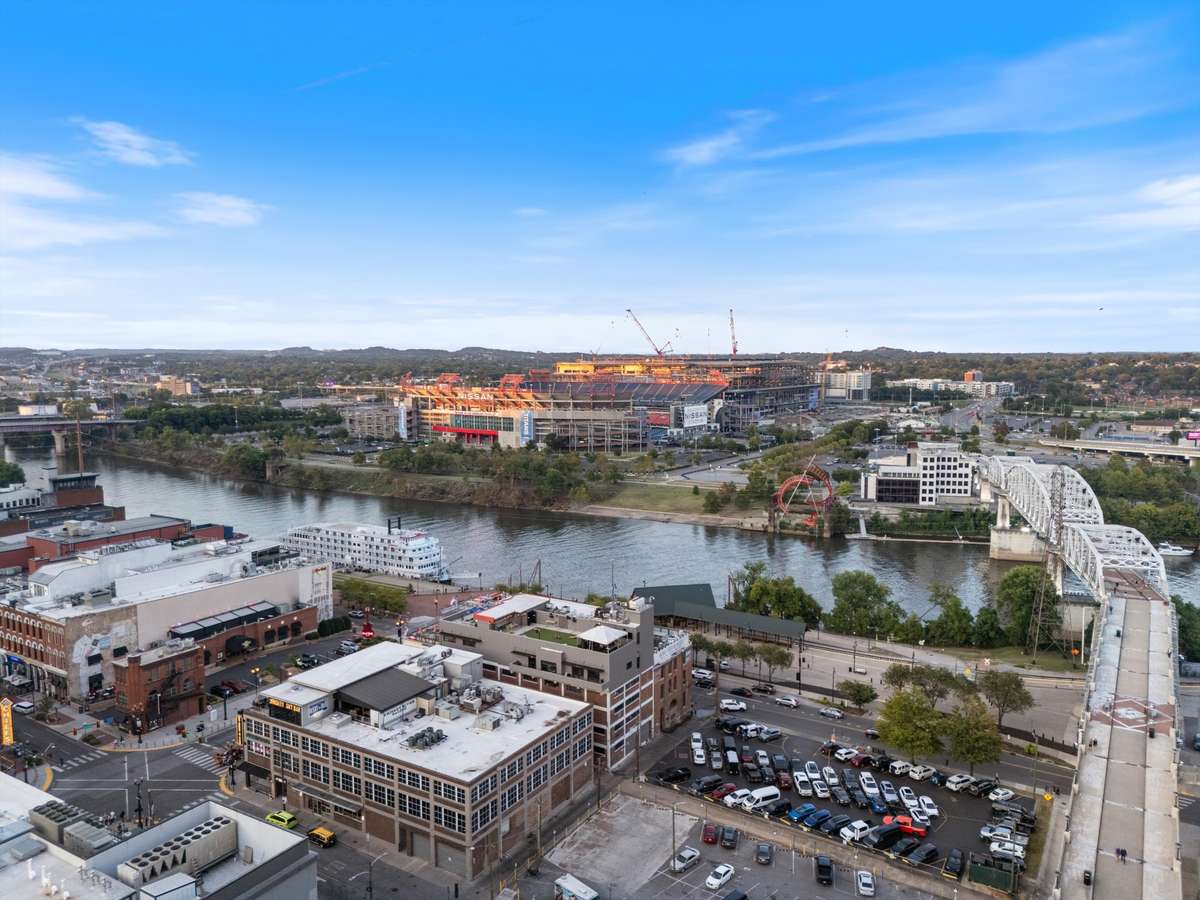 Cross over on the Pedestrian Bridge to the new Titans Stadium and what will be the Eastbank development
