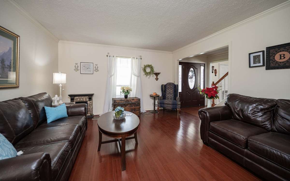 Home has 2 areas at entry for gathering.  This area and a den area with fireplace