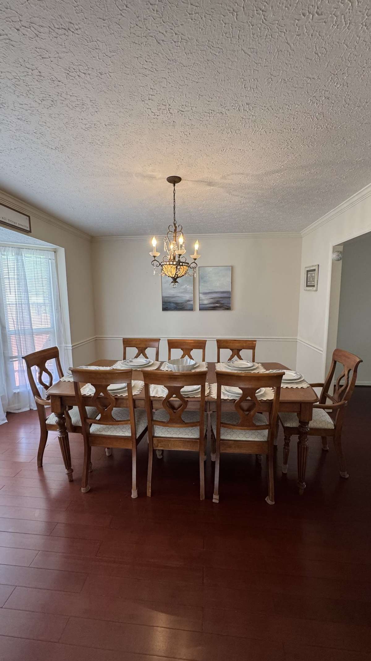 Dining room has lovely bay window with lots of natural lighting