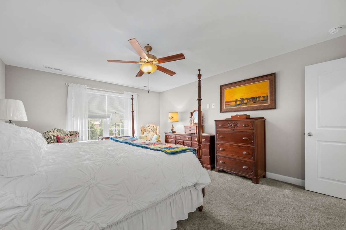 Large primary Bedroom and all windows of house have top down, bottom up cellular shades.
