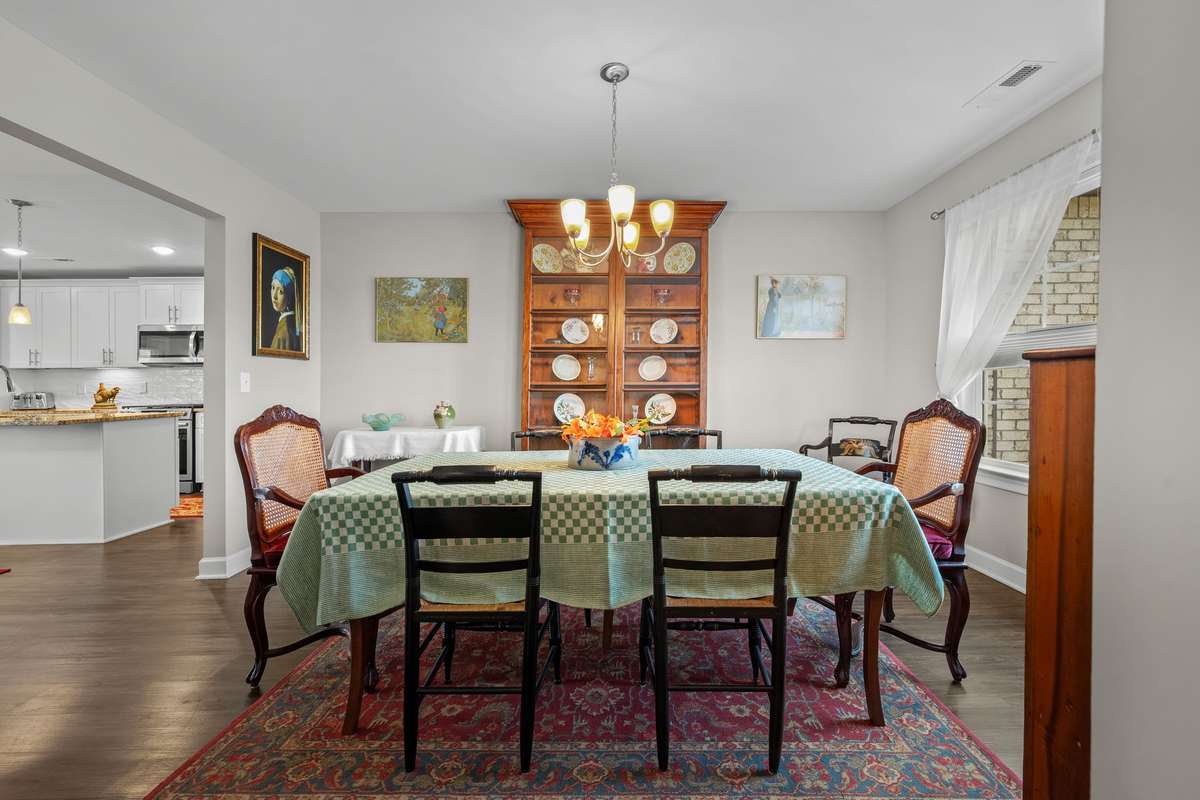Formal Dining Room with large window for lots of natural light. All windows of house have top down, bottom up cellular shades.