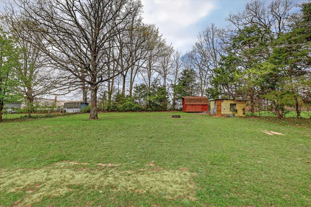 The home has a huge backyard with semi-privacy and two sheds for storage.