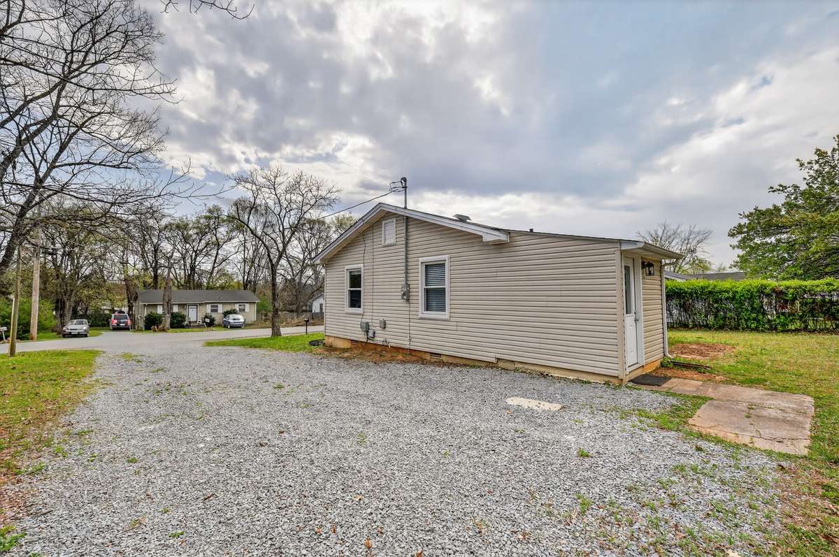 A view of the side of the house with the addition that was added as a Laundry room