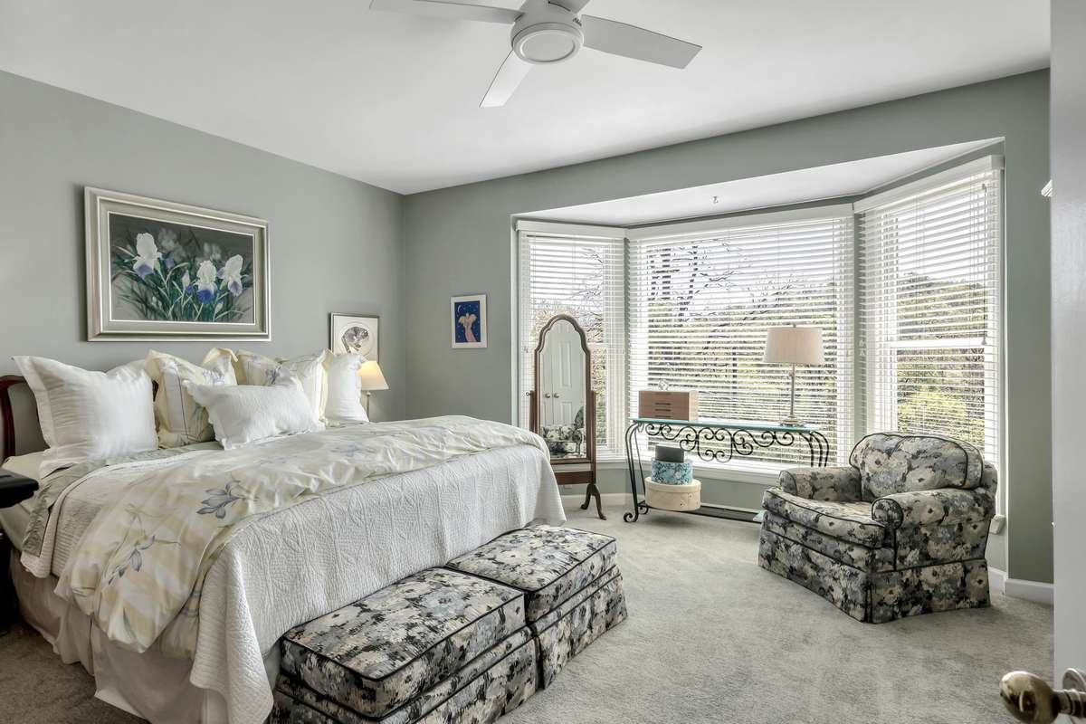Primary suite on second story at the opposite end of the hall from guest room. Laundry adjacent in hallway & another new Pella bay window!
