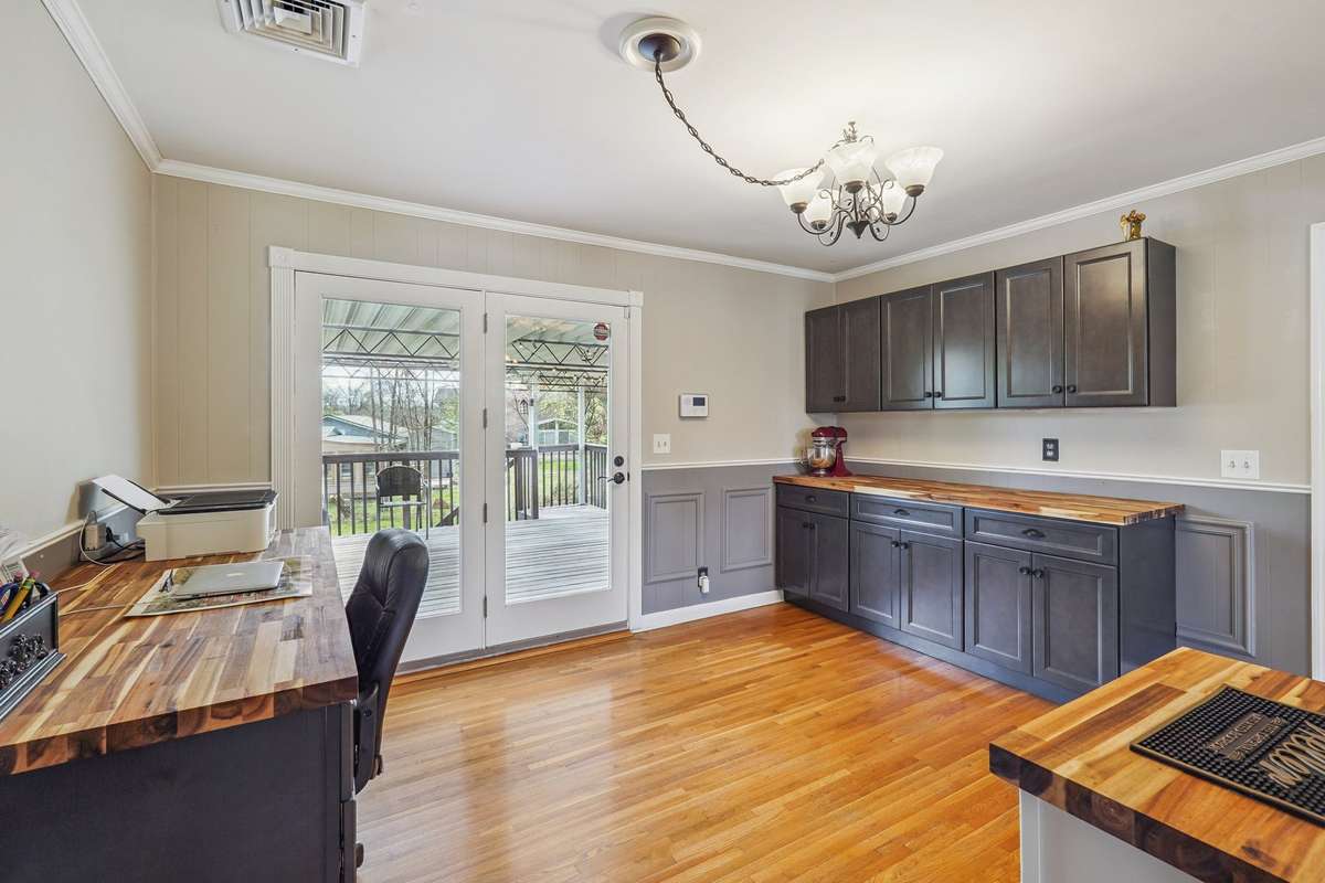 Enjoy the extra cabinetry and double doors to the awesome covered deck