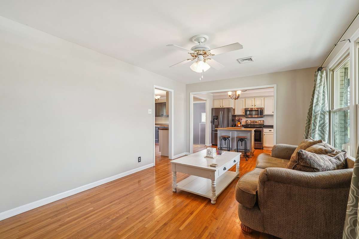 The living room has "sand & finish" hardwood floors