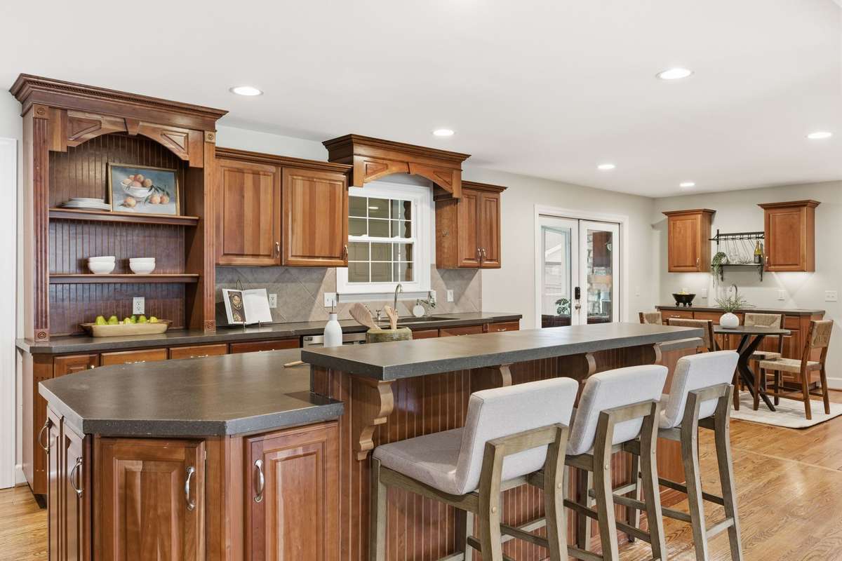 The kitchen is open to the family room, breakfast room, wet bar and dining room. This floor plan has a great flow for everyday living and entertaining.