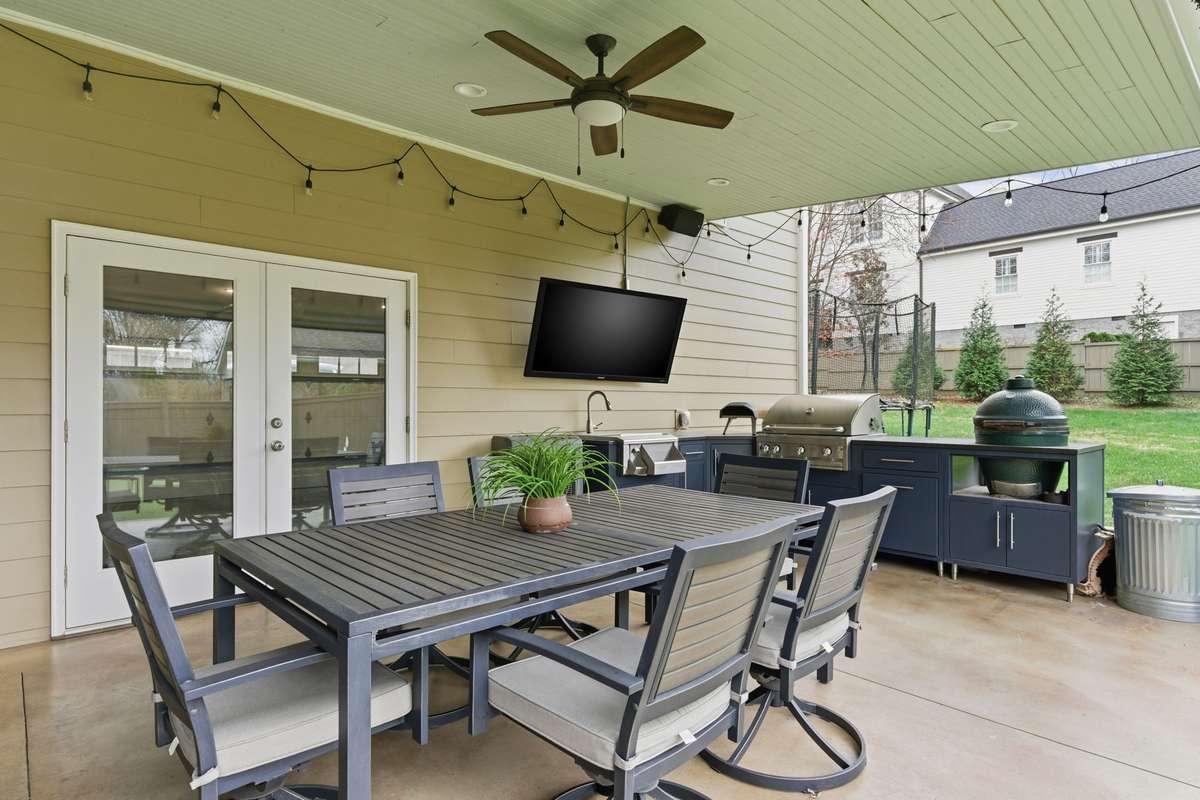Double doors lead into the garage where the ping pong table remains. Great space for entertaining and extra storage.