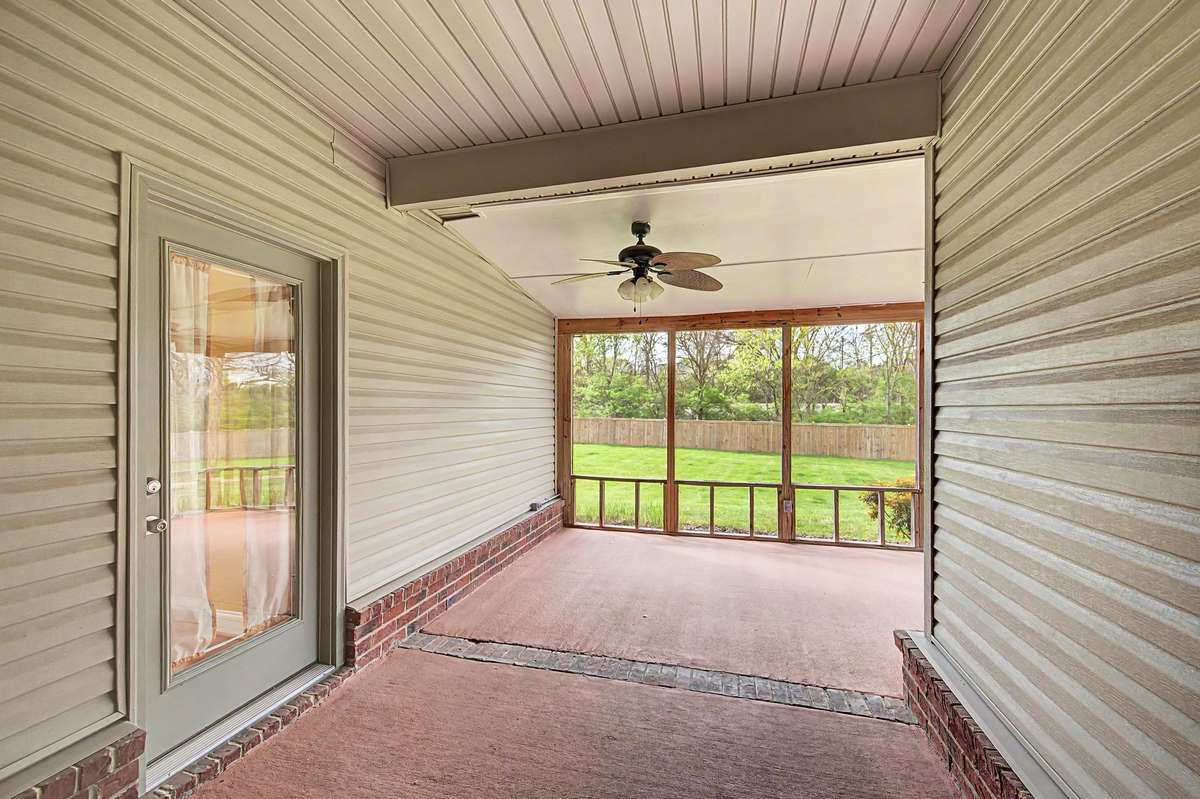 Porch overlooks backyard and common ground.