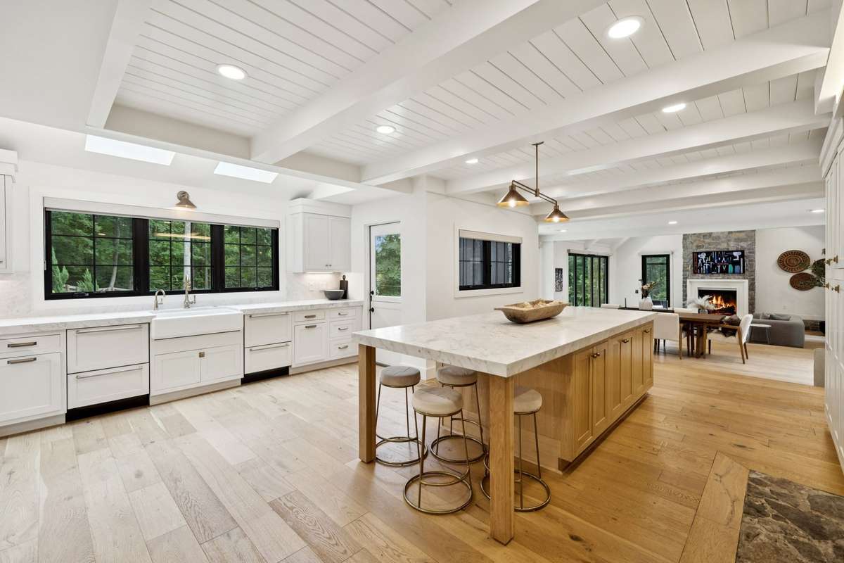 At the heart of the home, you'll find a chef-inspired kitchen outfitted with high-end, Fisher & Paykel appliances and crafted for both entertaining and everyday use