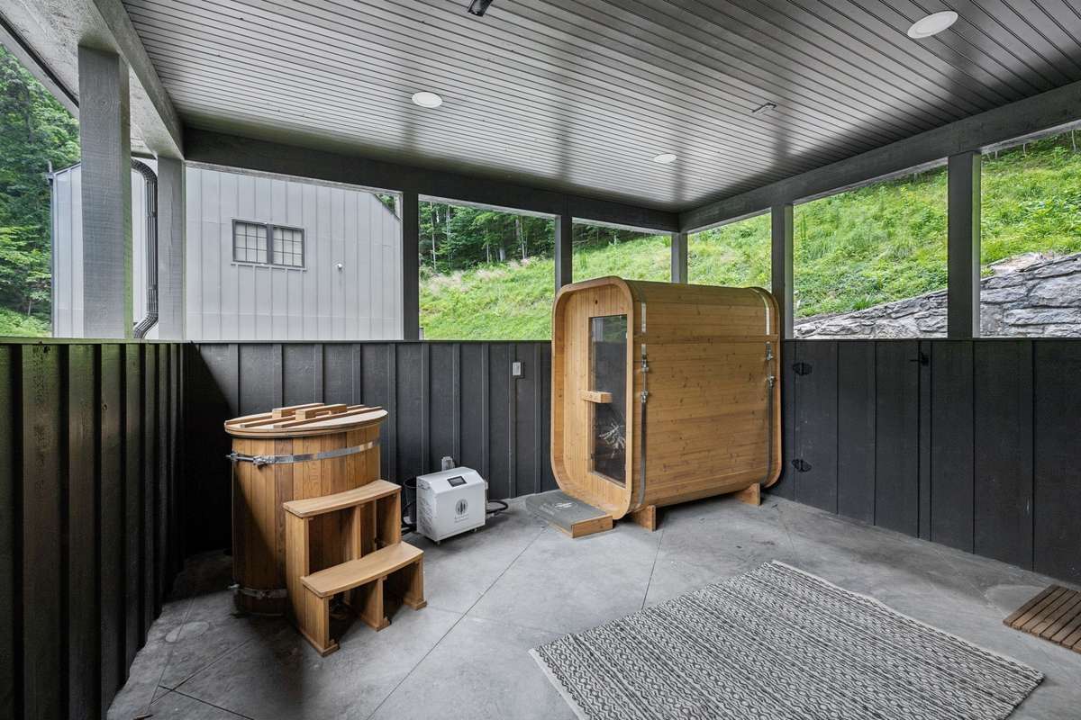 soak in the private spa oasis featuring a sauna, cold plunge, and open-air shower