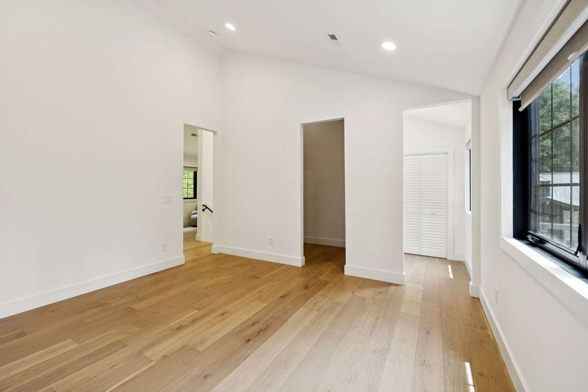 A 3-car garage provides generous parking and storage, with an expansive 1,500 sq ft flex space above—perfect for a private office, creative studio, or future guest suite.