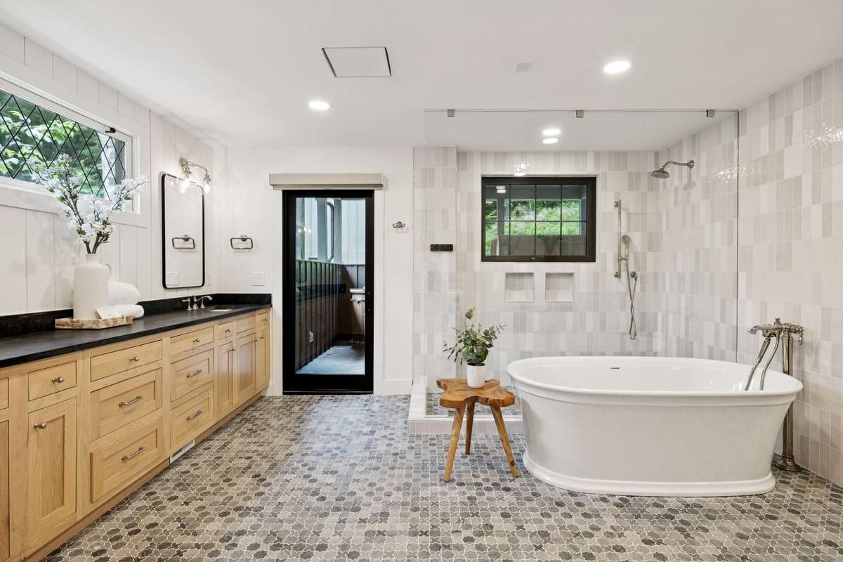 Step into the primary suite and experience true indulgence—complete with heated floors in the spa-like bathroom, designed for unwinding in style.