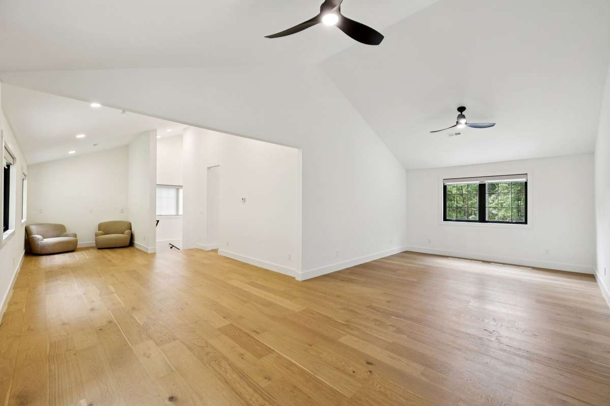 A 3-car garage provides generous parking and storage, with an expansive 1,500 sq ft flex space above—perfect for a private office, creative studio, or future guest suite.