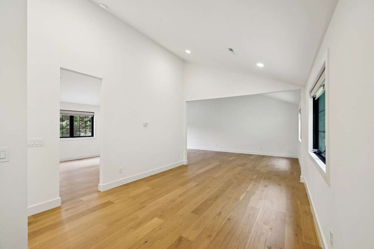 A 3-car garage provides generous parking and storage, with an expansive 1,500 sq ft flex space above—perfect for a private office, creative studio, or future guest suite.