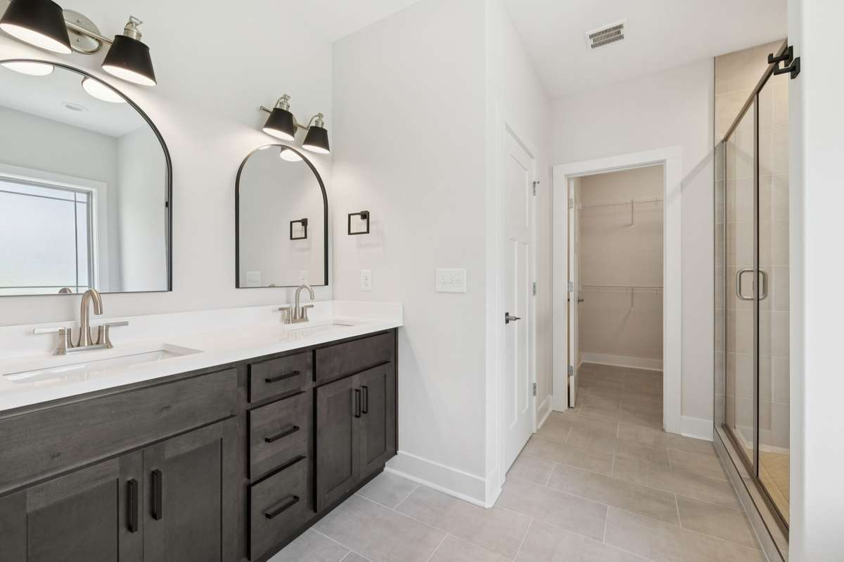 primary bathroom with double vanities