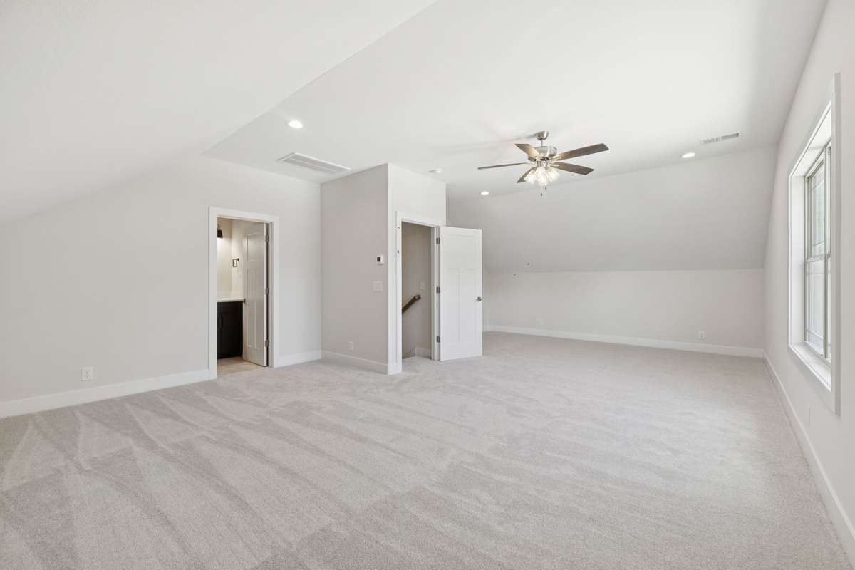 large bonus room  above garage with huge walk-in closet view 1