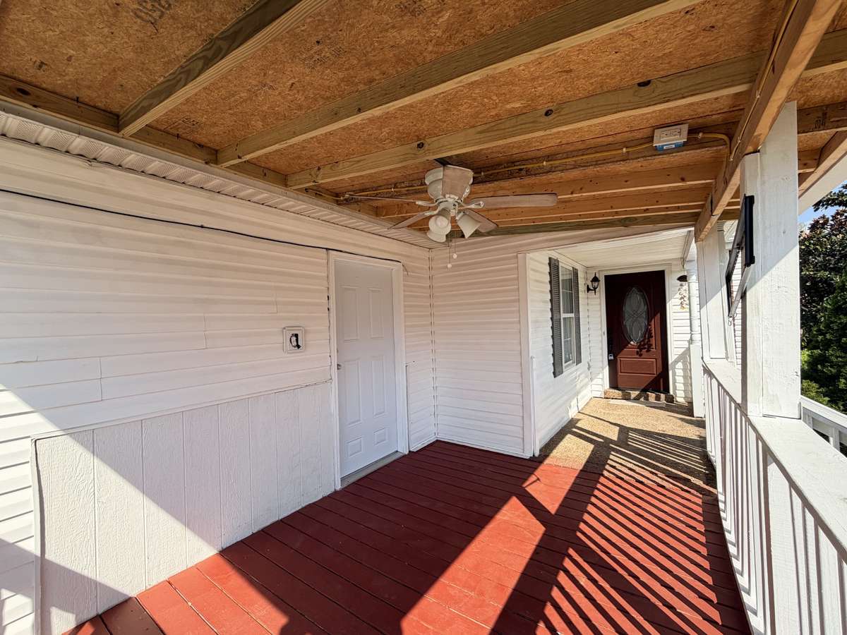 Nice covered porch with ceiling fan.  This House has a private entrance to the bonus room that can be use as a 4th bedroom.