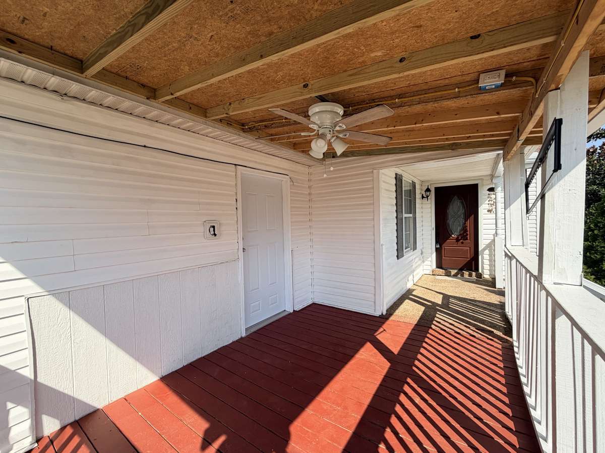 Nice covered porch with ceiling fan.  This House has a private entrance to the bonus room that can be use as a 4th bedroom.