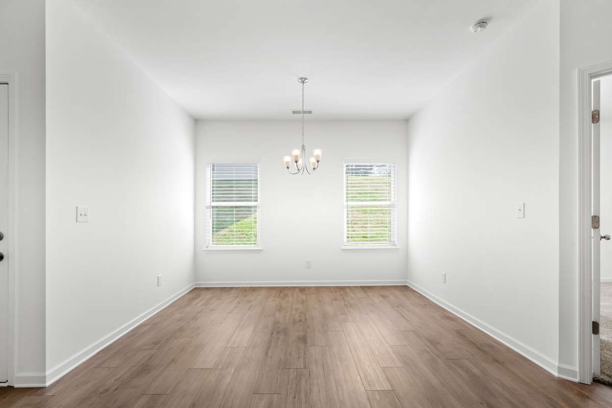 This dining area has space for your favorite table, and the high walls allow for a buffet or even a tall hutch to display some of your favorite things!