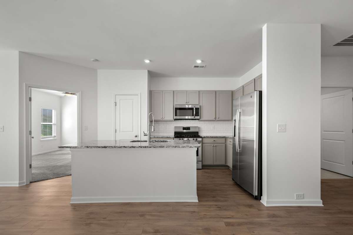 People love to gather around the kitchen, and this island is large enough to seat 4-5 stools or chairs.