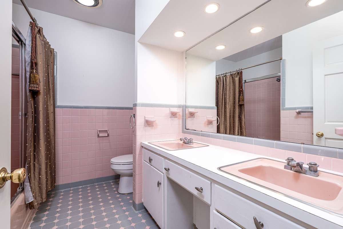 Full bath across the hall from Bedrooms with tub/shower combo and double sinks