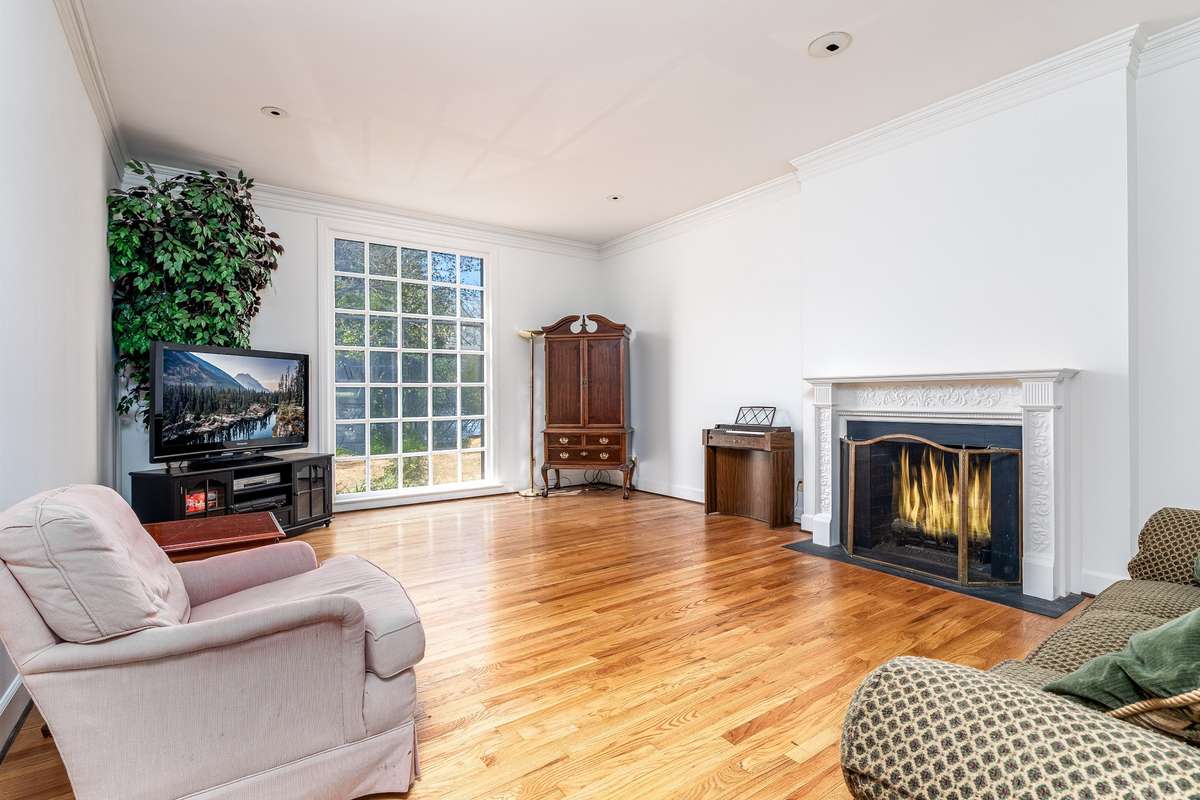 Very spacious Family Room with large floor to ceiling window and fireplace w/ gas logs