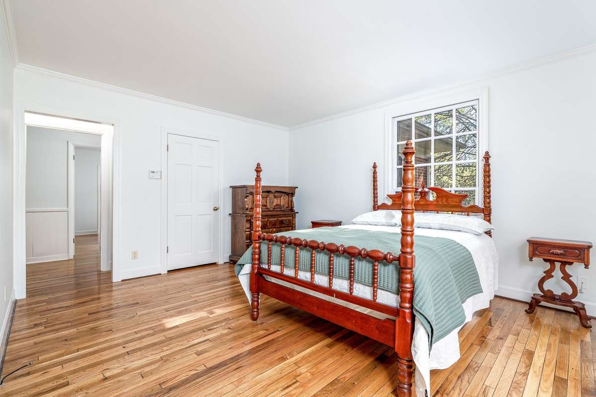 Another view of the Primary Suite. Beautiful hardwood floors
