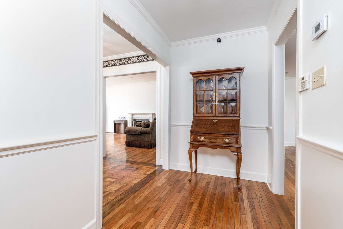 Hallway peaking into the front Family Room