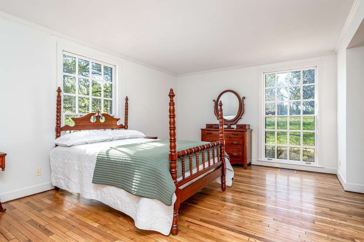 Primary Suite offers plenty of room for larger furniture, floor to ceiling windows and three closets