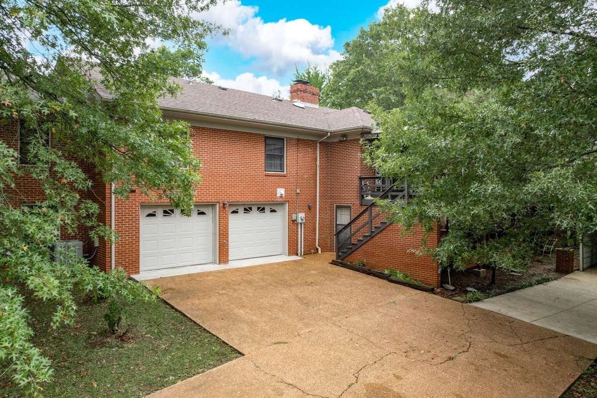 Double car garage and large concrete driveway