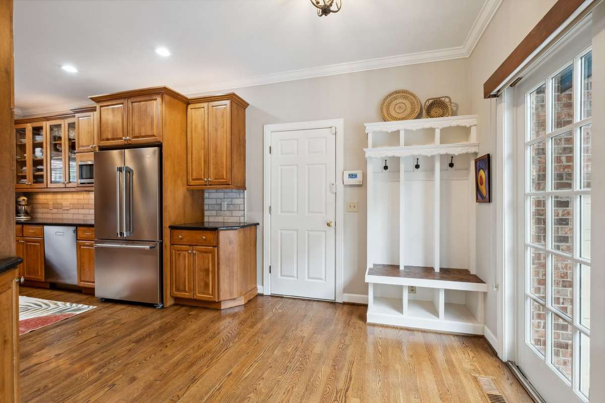 Another set of Anderson sliding glass doors lead to the pool and outdoor kitchen. As you come in from the garage there is a set of cubbies to drop your belongings and keep everyone organized.