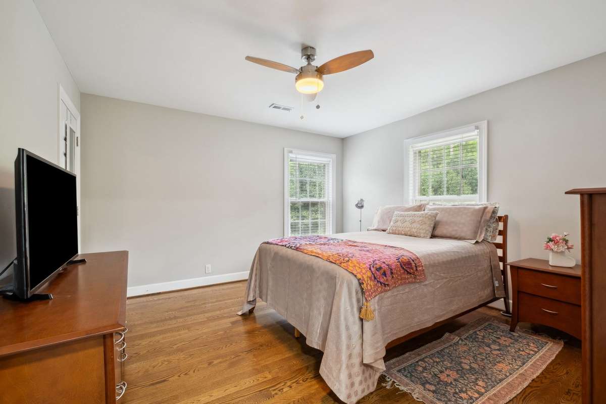 Bedroom number two overlooks the front yard and has a walk in closet, updated ceiling fan, 2" blinds and blackout shades.