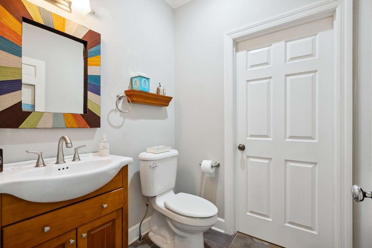 Off the entry is an updated powder room.