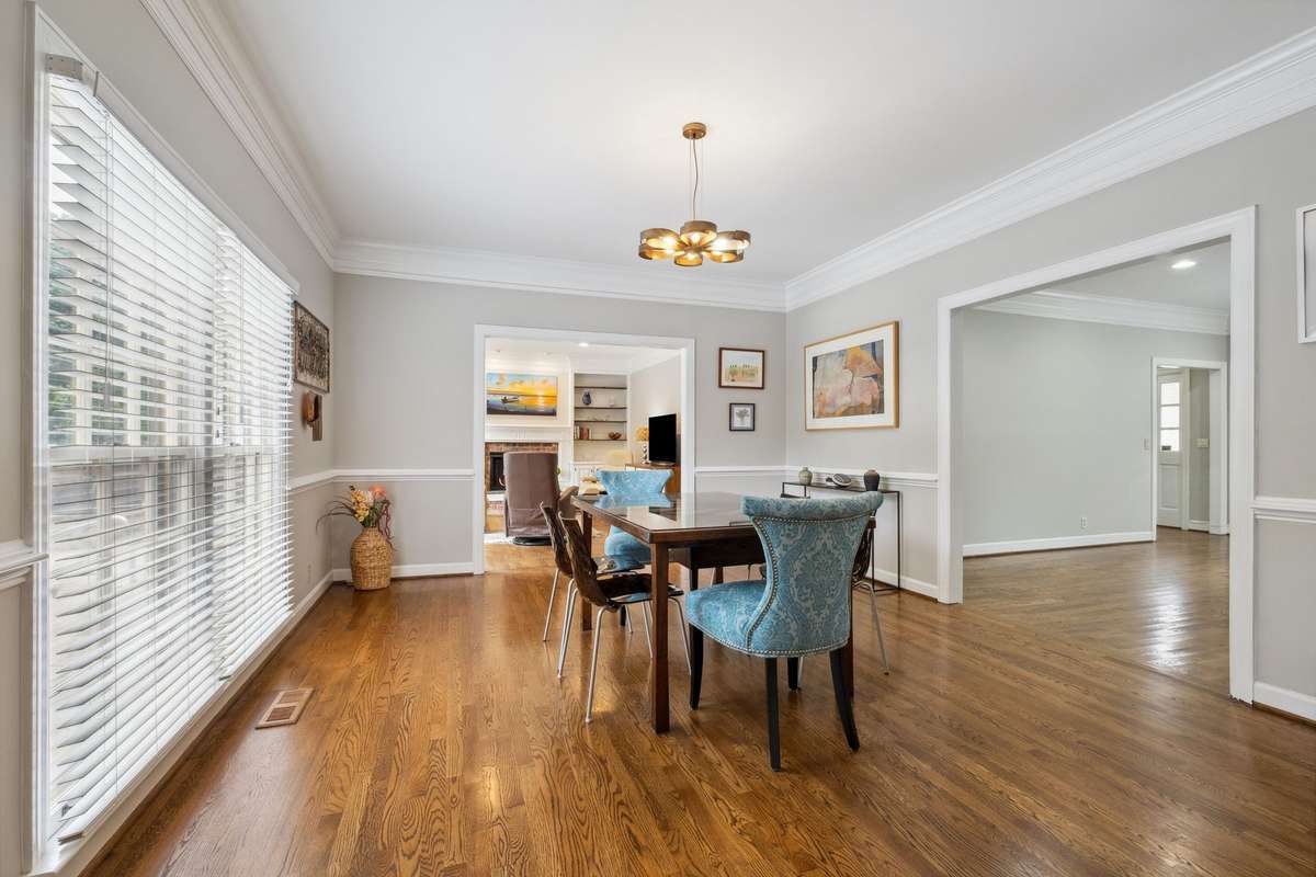 The dining room opens to the living room, den, and kitchen providing great flow for entertaining.