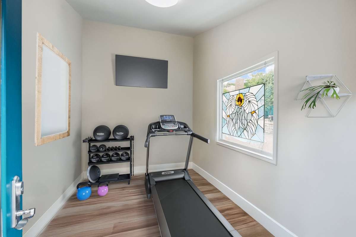 This is the space vrtually staged as a workout room.